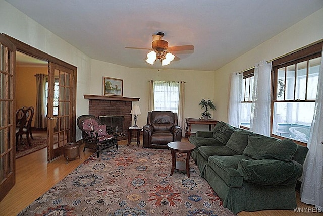 57 Dudley Ave, Hamburg, NY 14075 - living area with wood finished floors, ceiling fan, and a fireplace