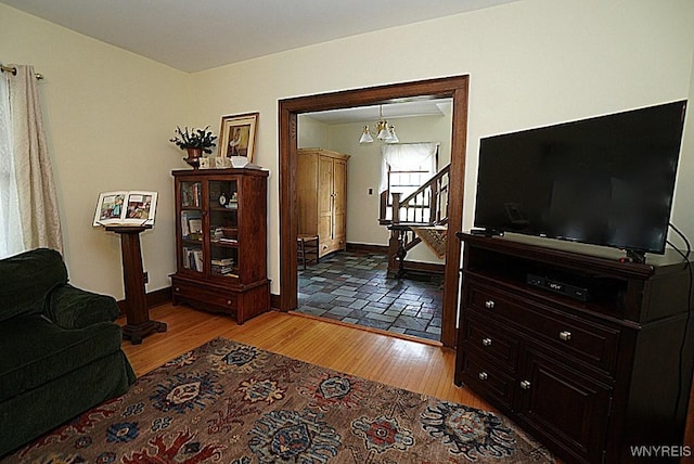 57 Dudley Ave, Hamburg, NY 14075 - living room featuring light wood-type flooring, a chandelier, and stairway