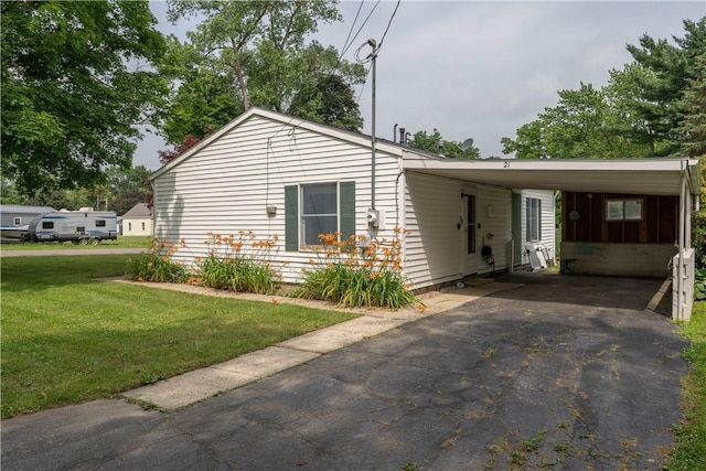 21 Twin Dr, North Dansville, NY 14437 - view of front of house featuring a front yard, an attached carport, and driveway