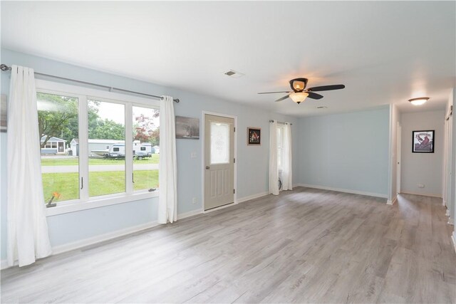 21 Twin Dr, North Dansville, NY 14437 - unfurnished living room with light wood-style floors and a ceiling fan