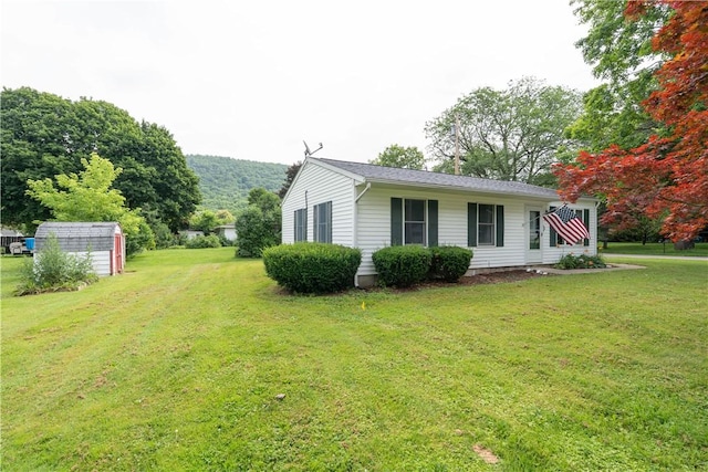 21 Twin Dr, North Dansville, NY 14437 - view of side of home with a shed and a yard