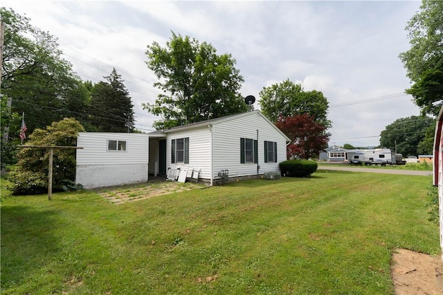 21 Twin Dr, North Dansville, NY 14437 - rear view of house featuring a yard
