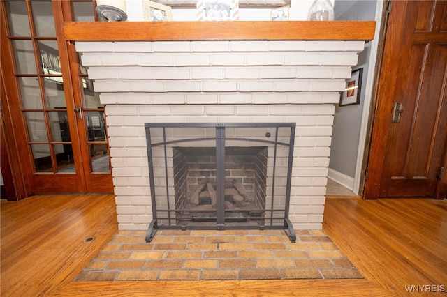 128 Argonne Dr, Tonawanda, NY 14217 - detailed view of wood finished floors and a fireplace