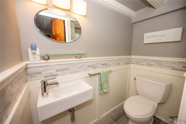 128 Argonne Dr, Tonawanda, NY 14217 - half bath featuring toilet and wainscoting