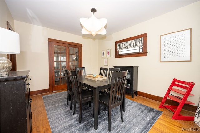 128 Argonne Dr, Tonawanda, NY 14217 - dining space with wood finished floors and french doors