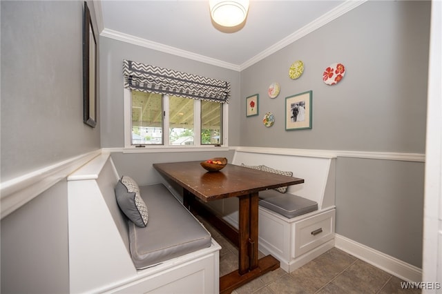 128 Argonne Dr, Tonawanda, NY 14217 - dining area with breakfast area, ornamental molding, and dark tile patterned flooring