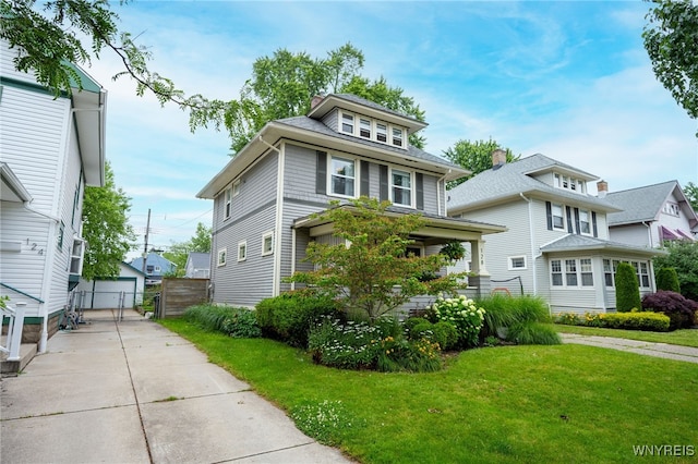 128 Argonne Dr, Tonawanda, NY 14217 - traditional style home with a front lawn, an outdoor structure, and a garage