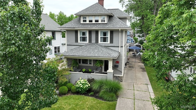 128 Argonne Dr, Tonawanda, NY 14217 - american foursquare style home with roof with shingles, a chimney, and a porch