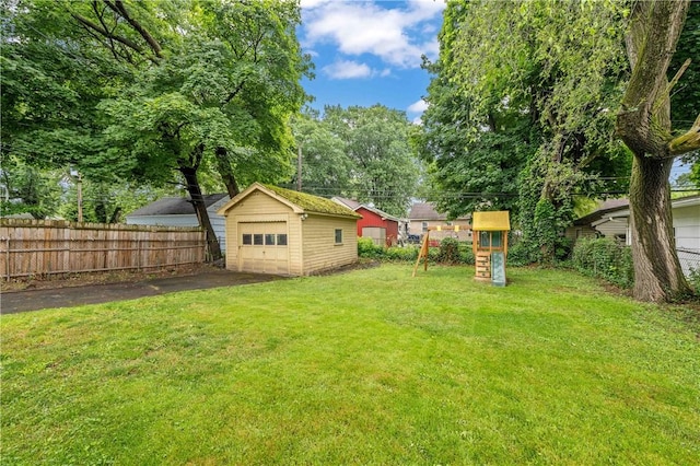 111 Hartsdale Rd, Irondequoit, NY 14622 - view of yard featuring a playground, a garage, and an outdoor structure