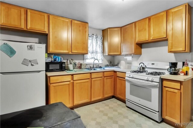 139 Boncroft Dr, West Seneca, NY 14224 - kitchen featuring white appliances, light countertops, and light flooring
