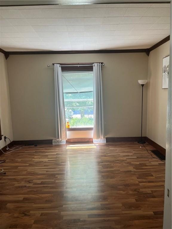 325 E 3rd St, Corning City, NY 14830 - unfurnished room featuring crown molding and dark wood-style flooring