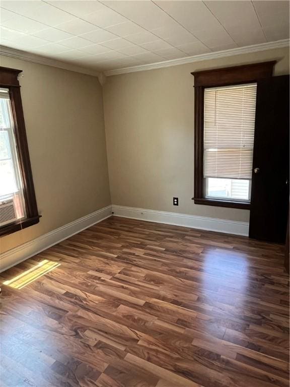 325 E 3rd St, Corning City, NY 14830 - empty room with ornamental molding, healthy amount of natural light, and dark wood finished floors