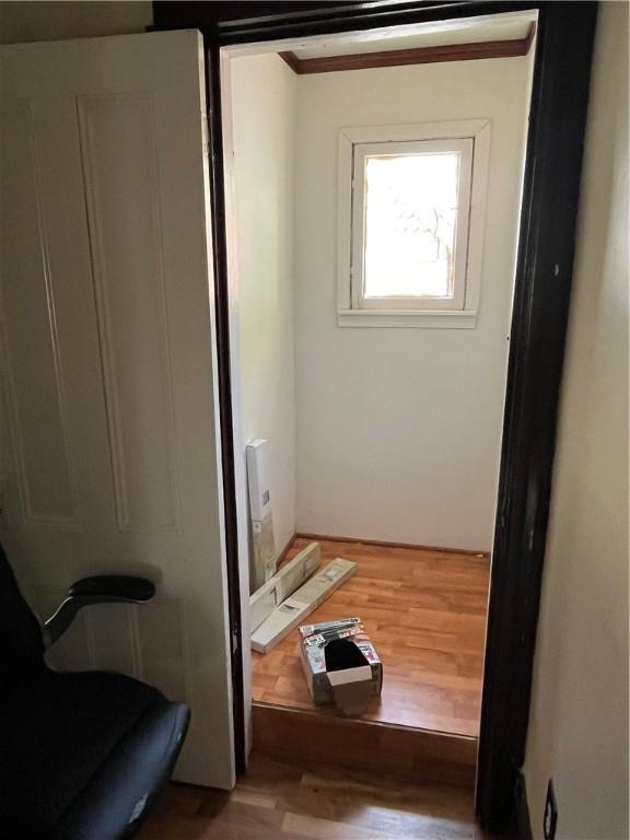 325 E 3rd St, Corning City, NY 14830 - bathroom featuring wood finished floors and ornamental molding
