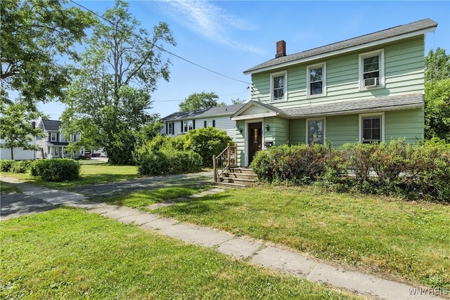349 Willow St, Lockport City, NY 14094 - view of front of property featuring a chimney and a front lawn