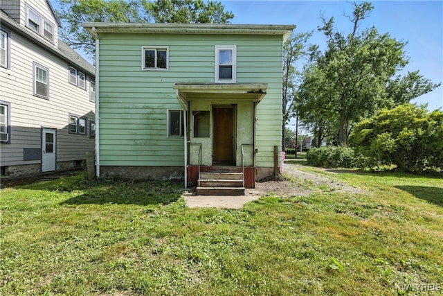 349 Willow St, Lockport City, NY 14094 - back of house with a lawn and entry steps