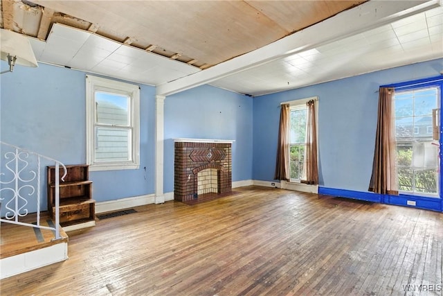 349 Willow St, Lockport City, NY 14094 - unfurnished living room featuring wood-type flooring and a fireplace