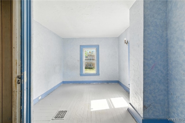 349 Willow St, Lockport City, NY 14094 - empty room featuring wood finished floors and baseboards