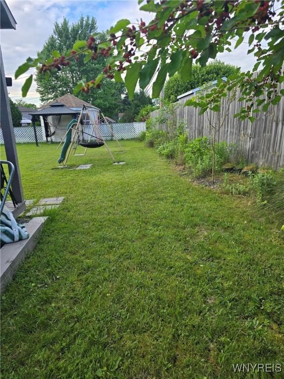 207 Shetland Dr, Amherst, NY 14221 - fenced backyard with a playground