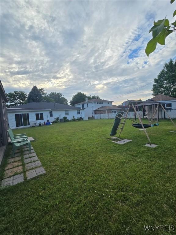207 Shetland Dr, Amherst, NY 14221 - view of grassy yard with a playground