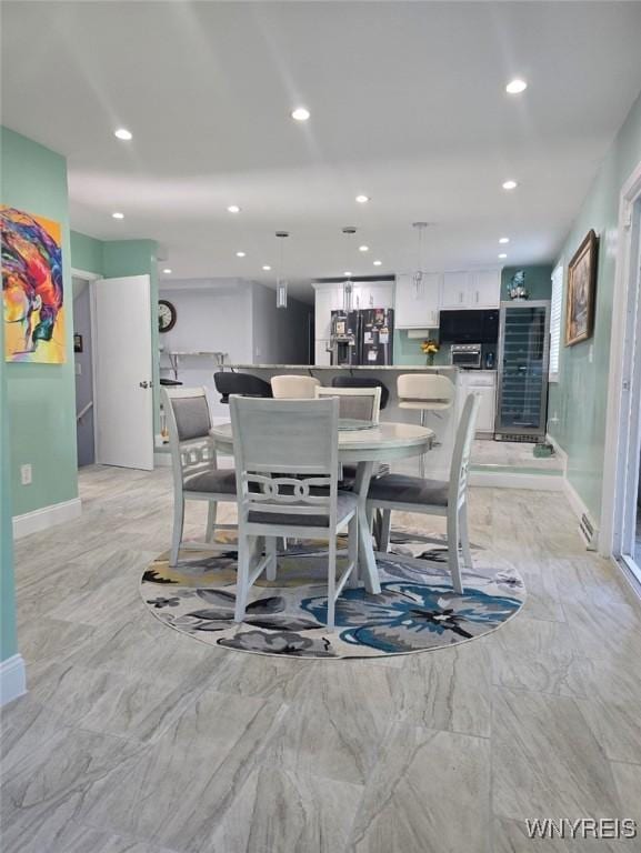 207 Shetland Dr, Amherst, NY 14221 - dining room with recessed lighting and light marble finish floors