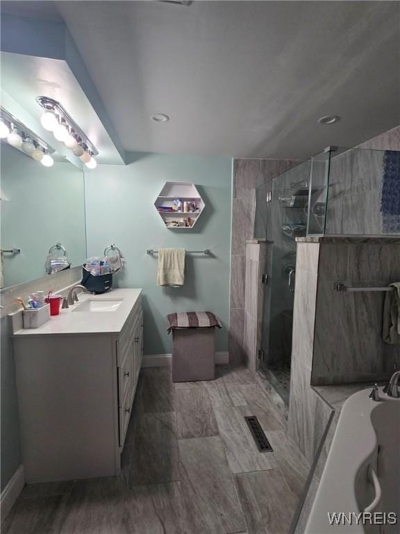 207 Shetland Dr, Amherst, NY 14221 - bathroom with vanity, a bath, and a shower stall