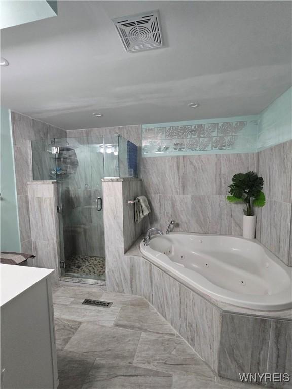 207 Shetland Dr, Amherst, NY 14221 - full bathroom featuring a whirlpool tub, a shower stall, and vanity