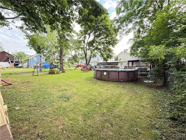 41 Owego St, Cortland, NY 13045 - view of yard with a playground and an outdoor pool