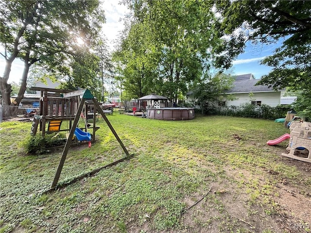 41 Owego St, Cortland, NY 13045 - view of green lawn with a playground and an outdoor pool