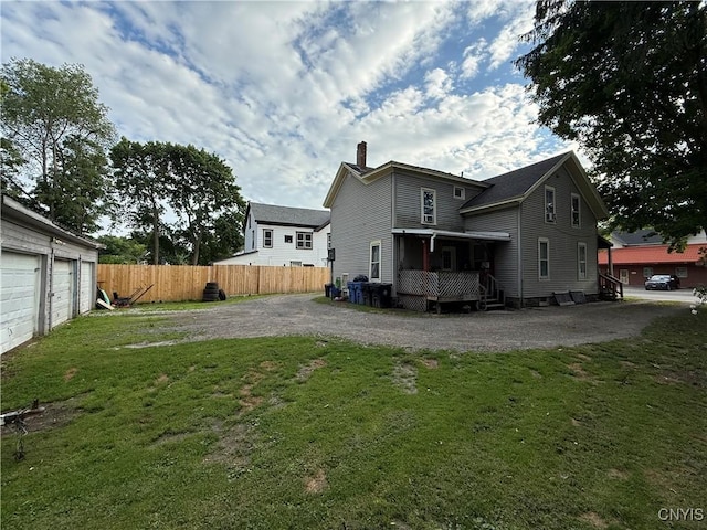 41 Owego St, Cortland, NY 13045 - back of house with a chimney and driveway