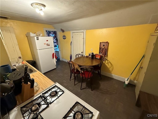 41 Owego St, Cortland, NY 13045 - dining area featuring vaulted ceiling and baseboards