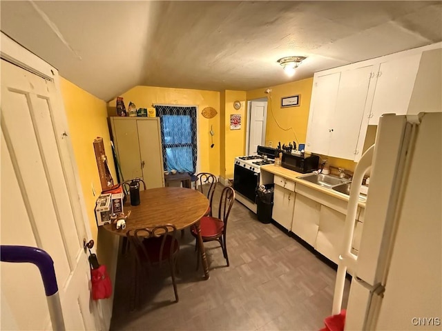41 Owego St, Cortland, NY 13045 - kitchen featuring white appliances, light floors, light countertops, and white cabinetry