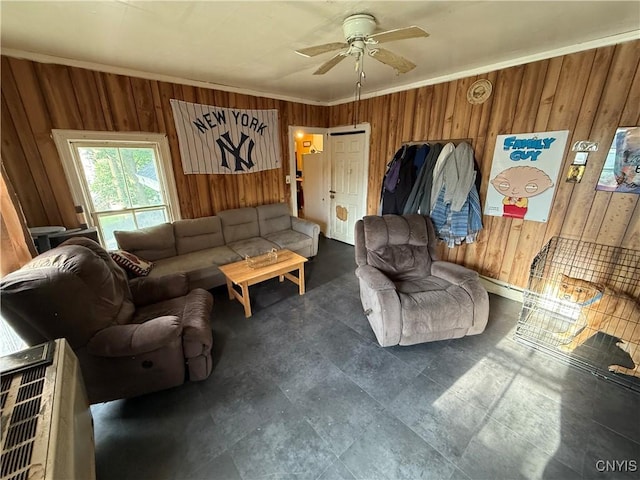 41 Owego St, Cortland, NY 13045 - living room featuring wood walls, ceiling fan, and crown molding
