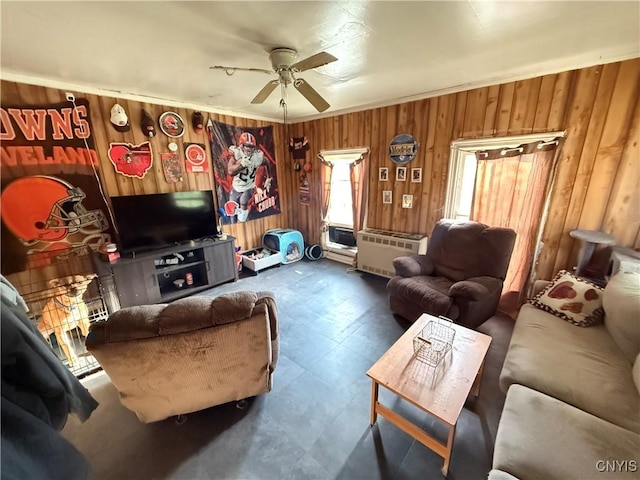 41 Owego St, Cortland, NY 13045 - living room with wood walls, a ceiling fan, and tile patterned floors
