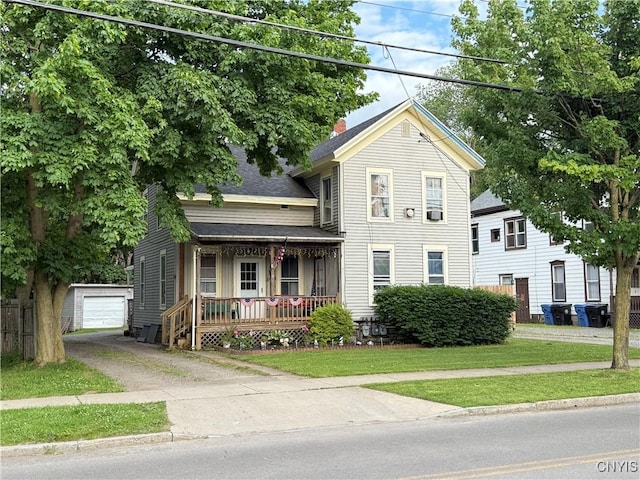41 Owego St, Cortland, NY 13045 - view of front of property featuring covered porch, an outbuilding, driveway, a shingled roof, and a front yard