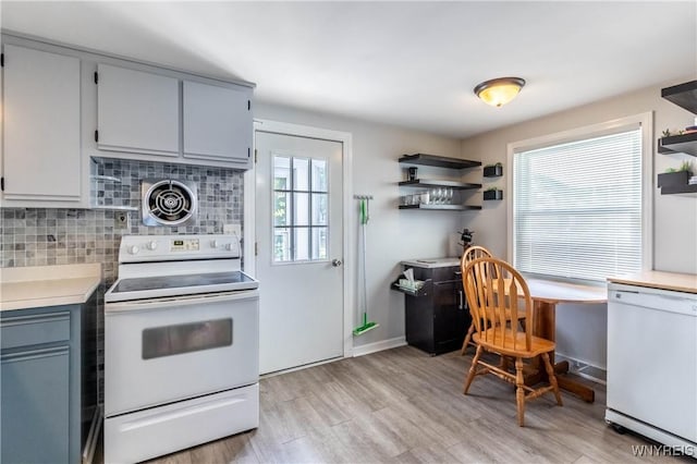 686 Harrison Ave, Tonawanda, NY 14223 - kitchen featuring white appliances, open shelves, tasteful backsplash, light countertops, and light wood-style flooring