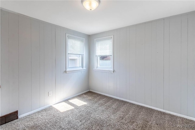 686 Harrison Ave, Tonawanda, NY 14223 - carpeted empty room with baseboards