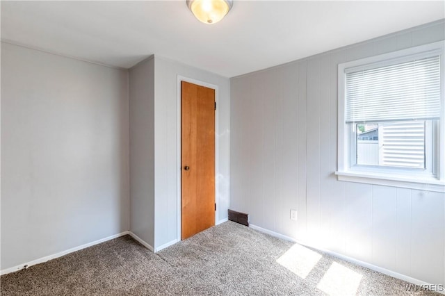 686 Harrison Ave, Tonawanda, NY 14223 - unfurnished bedroom with carpet and baseboards