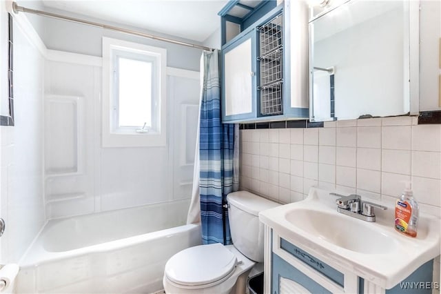 686 Harrison Ave, Tonawanda, NY 14223 - full bathroom with backsplash, shower / bath combination with curtain, tile walls, and vanity