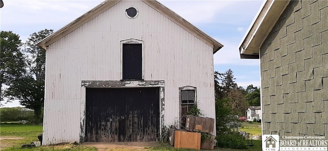 4604 W Railroad Ave, Stockton, NY 14874 - view of side of home with a barn and an outbuilding