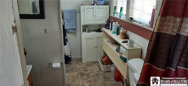 4604 W Railroad Ave, Stockton, NY 14874 - bathroom with stone finish floors and baseboards