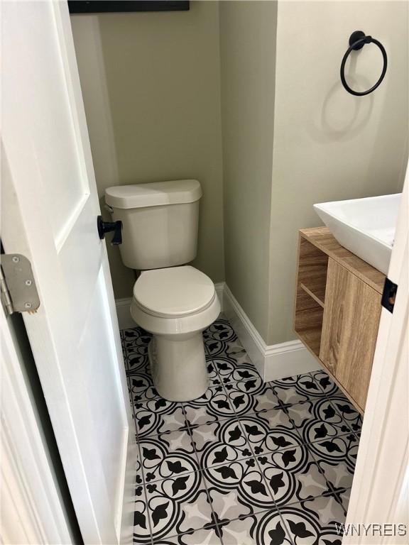 575 Willow Ave, North Tonawanda, NY 14120 - half bathroom with vanity and tile patterned floors