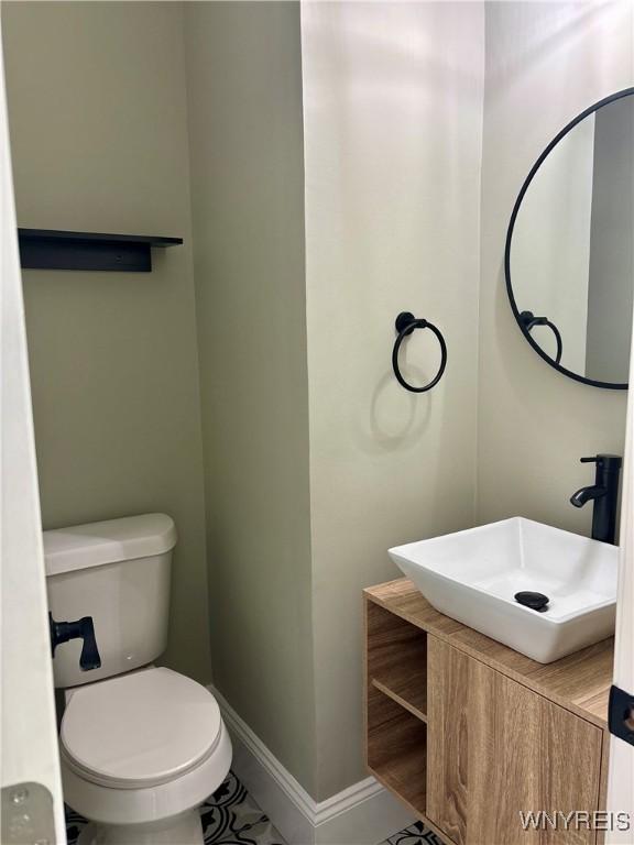 575 Willow Ave, North Tonawanda, NY 14120 - half bath with vanity and tile patterned floors