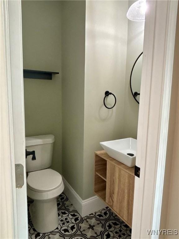 575 Willow Ave, North Tonawanda, NY 14120 - half bath with vanity and tile patterned flooring