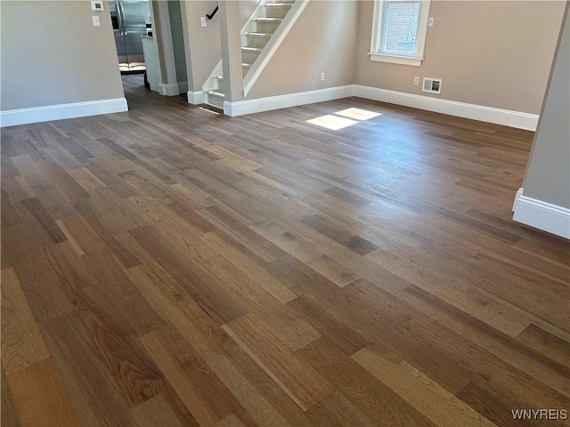575 Willow Ave, North Tonawanda, NY 14120 - spare room with dark wood-type flooring and stairs