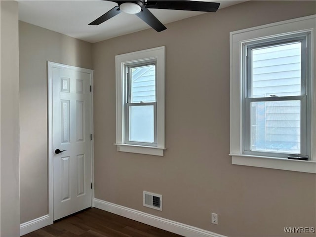 575 Willow Ave, North Tonawanda, NY 14120 - unfurnished room with dark wood-style floors and ceiling fan
