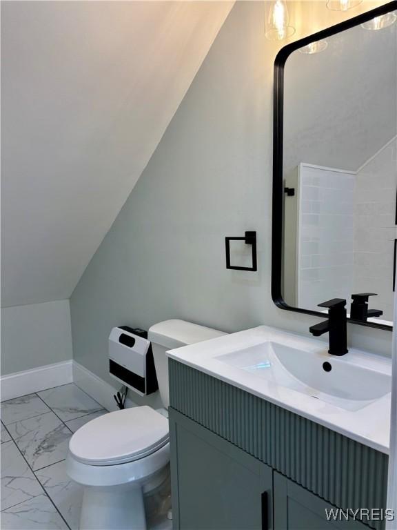 575 Willow Ave, North Tonawanda, NY 14120 - bathroom featuring marble look tiles and vanity