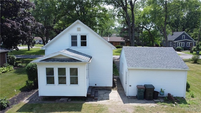 575 Willow Ave, North Tonawanda, NY 14120 - back of property featuring a yard and a shingled roof