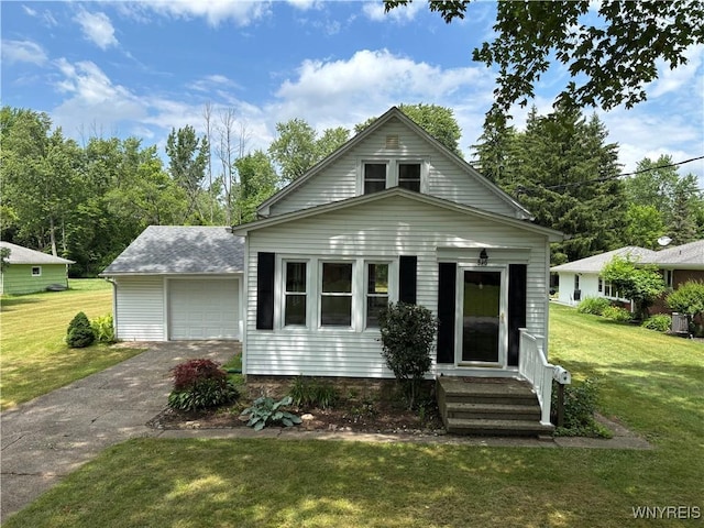 575 Willow Ave, North Tonawanda, NY 14120 - view of front of house featuring asphalt driveway, a front lawn, a garage, and entry steps