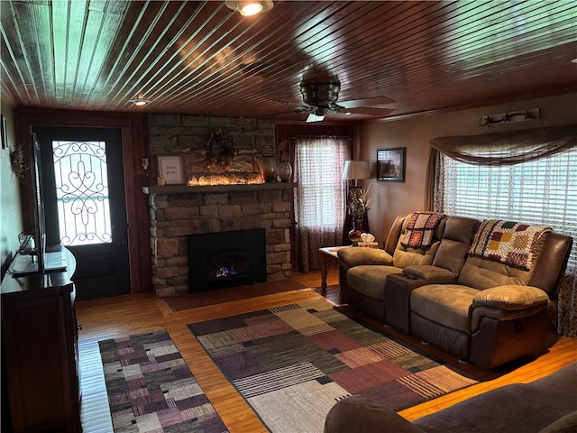 15 Clark Dr, Otto Twp, PA 16745 - living area with a ceiling fan, wooden ceiling, a stone fireplace, and wood finished floors
