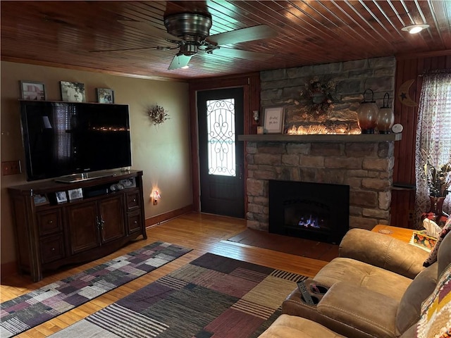 15 Clark Dr, Otto Twp, PA 16745 - living room with light wood finished floors, a ceiling fan, wood ceiling, and a stone fireplace